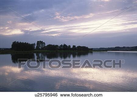 Stock Photograph - The Lakeside In A Morning Glow. Fotosearch