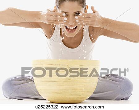 Woman washing face View Large Photo Image Stock Image - Woman washing face. Fotosearch
