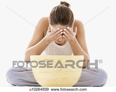 Stock Photo - Woman washing face. Fotosearch