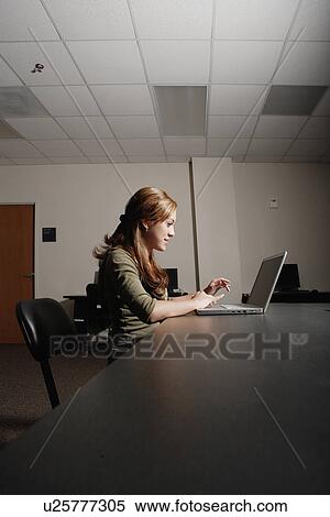 Female college student working on computer View Large Photo Image Stock Photography - Female college student working on computer. Fotosearch