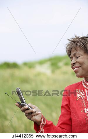 Stock Photography - Woman text messaging. Fotosearch