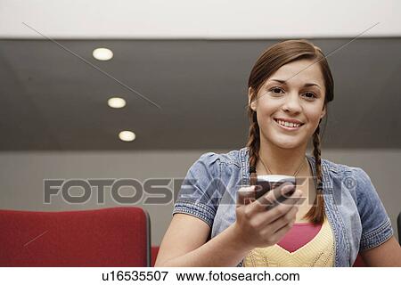 Stock Photo - College student using PDA. Fotosearch