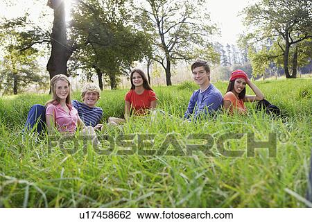 Five teenagers sitting in field (portrait) View Large Photo Image Stock Image - Five teenagers sitting in field (portrait). Fotosearch