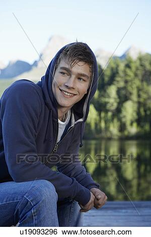 Teenage boy by lake, Cape Town, South Africa View Large Photo Image Stock Photograph - Teenage boy by lake, Cape Town, South Africa. Fotosearch