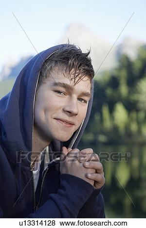 Teenage boy in hooded top (portrait) View Large Photo Image Stock Photo - Teenage boy in hooded top (portrait). Fotosearch