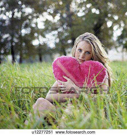 Teenage Girl Holding Heart Shaped Cushion View Large Photo Image Stock Image - Teenage Girl Holding Heart Shaped Cushion. Fotosearch