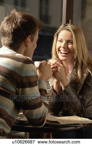 Mid adult couple with road maps drinking coffee View Large Photo Image Stock Photo - Mid adult couple with road maps drinking coffee. Fotosearch