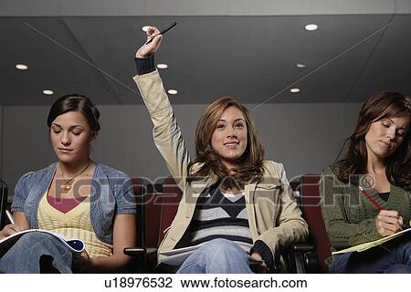 Three female students participating in lecture View Large Photo Image Stock Image - Three female students participating in lecture. Fotosearch