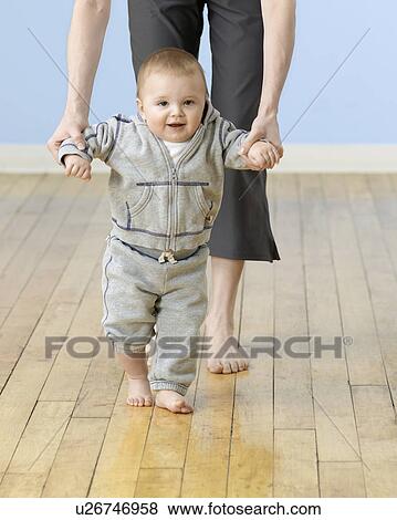 Stock Photo - Baby Boy Learning to Walk. Fotosearch