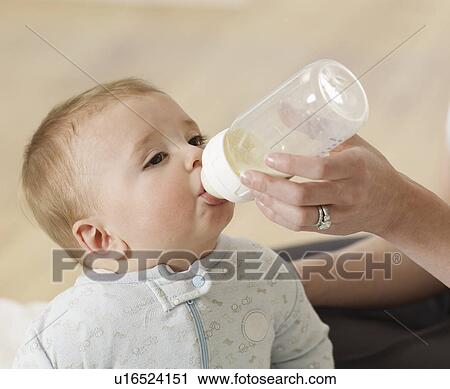 Baby Boy Sucking Milk Bottle View Large Photo Image Stock Image - Baby Boy Sucking Milk Bottle. Fotosearch