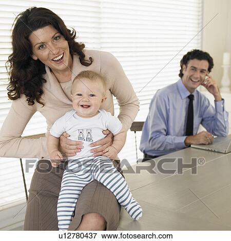 Mid adult couple with baby boy (0-6 months) View Large Photo Image Stock Photo - Mid adult couple with baby boy (0-6 months). Fotosearch