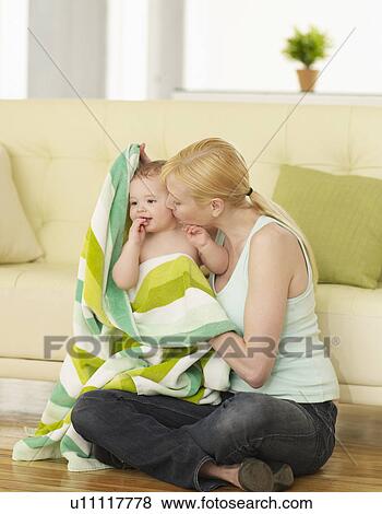 Stock Photo - Mother Drying Baby Boy with Towel. Fotosearch