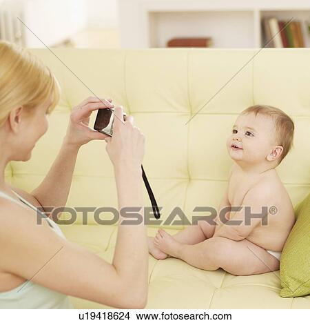 Picture - Mother Photographing Baby Boy. Fotosearch