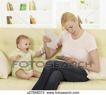 Picture - Mother with Baby Boy Checking Mail. Fotosearch