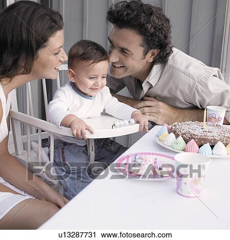 Parents celebrating baby boy's (1-2) birthday View Large Photo Image Stock Image - Parents celebrating baby boy's (1-2) birthday. Fotosearch