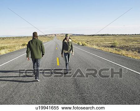 Man and woman passing each other on wrong sides of road View Large Photo Image Stock Photography - Man and woman passing each other on wrong sides of road. Fotosearch