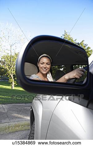 Mid Adult Woman Reflected in Side Mirror View Large Photo Image Stock Photo - Mid Adult Woman Reflected in Side Mirror. Fotosearch
