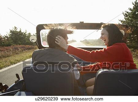 Young couple driving beach buggy (rear view) View Large Photo Image Stock Photo - Young couple driving beach buggy (rear view). Fotosearch