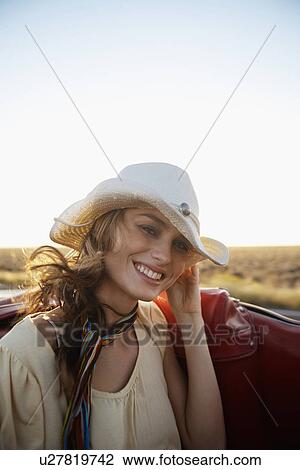 Young woman in cowboy hat traveling in convertible View Large Photo Image Stock Image - Young woman in cowboy hat traveling in convertible. Fotosearch