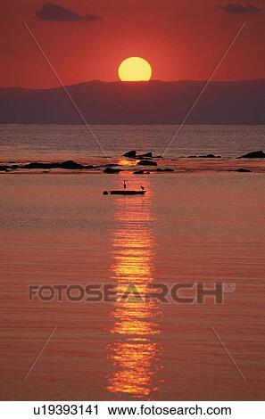 Stock Image - Sunset At Sea. Fotosearch