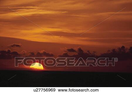 The Setting Sun On The Beach View Large Photo Image Stock Photo - The Setting Sun On The Beach. Fotosearch