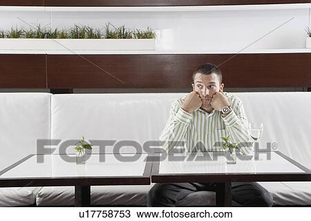Businessman waiting in restaurant View Large Photo Image Stock Image - Businessman waiting in restaurant. Fotosearch