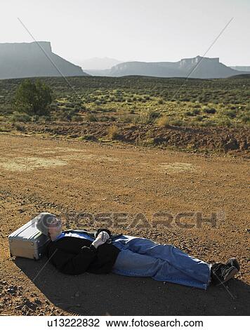 Hitchhiker Sleeping at Roadside View Large Photo Image Stock Image - Hitchhiker Sleeping at Roadside. Fotosearch
