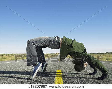 Man doing bridge on highway View Large Photo Image Stock Photo - Man doing bridge on highway. Fotosearch
