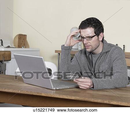 Mid-Adult Man Shopping Online View Large Photo Image Stock Photo - Mid-Adult Man Shopping Online. Fotosearch