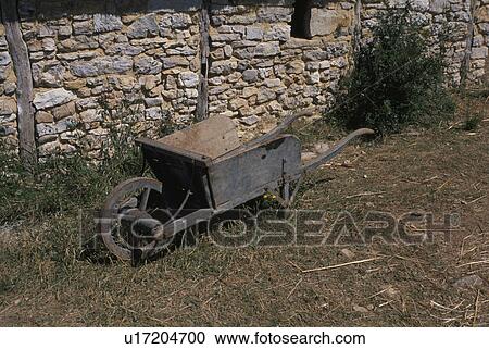 Stock Image - A Stone-Made Hut And A Cart. Fotosearch