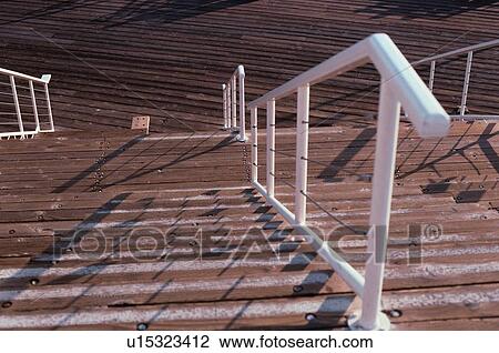 Stock Image - Wooden Steps And Banister. Fotosearch