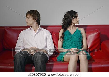 Young couple arguing on sofa View Large Photo Image Stock Image - Young couple arguing on sofa. Fotosearch