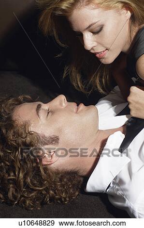 Stock Photo - Young couple embracing. Fotosearch