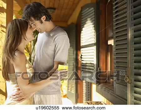 Young couple hugging in patio View Large Photo Image Stock Photography - Young couple hugging in patio. Fotosearch