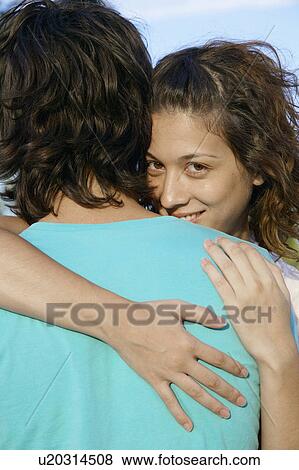 Young couple hugging View Large Photo Image Stock Photo - Young couple hugging. Fotosearch