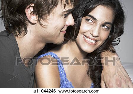 Young couple hugging View Large Photo Image Stock Photograph - Young couple hugging. Fotosearch