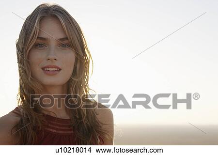 Portrait of young woman at dusk View Large Photo Image Picture - Portrait of young woman at dusk. Fotosearch