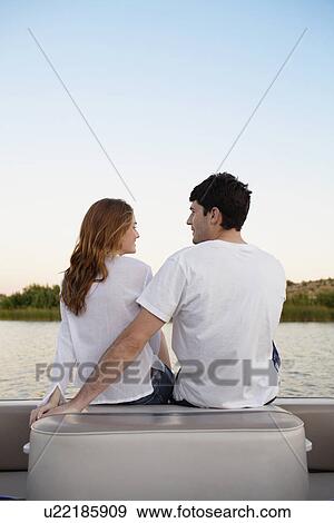 Stock Photo - Young couple at lake. Fotosearch