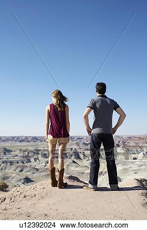 Picture - Young couple looking at rocky landscape, Arizona, USA. Fotosearch