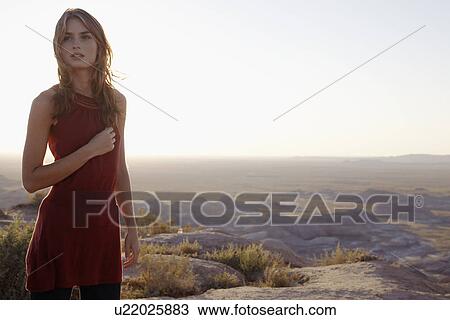 Young woman on barren landscape, Arizona, USA View Large Photo Image Stock Image - Young woman on barren landscape, Arizona, USA. Fotosearch
