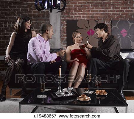 Four Friends With Drinks at Party View Large Photo Image Stock Photo - Four Friends With Drinks at Party. Fotosearch