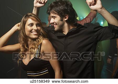 Young couple dancing at nightclub View Large Photo Image Stock Photo - Young couple dancing at nightclub. Fotosearch