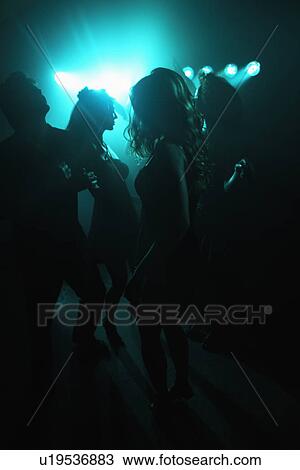 Young people clubbing (back lighting) View Large Photo Image Stock Image - Young people clubbing (back lighting). Fotosearch
