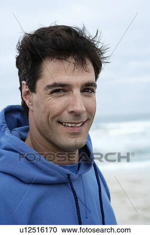 Portrait of mid adult man on beach View Large Photo Image Stock Image - Portrait of mid adult man on beach. Fotosearch