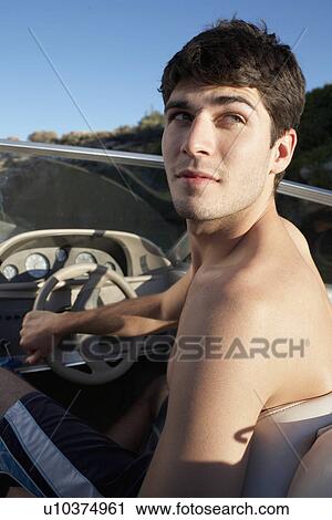 Young man driving beach buggy View Large Photo Image Stock Image - Young man driving beach buggy. Fotosearch