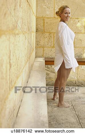 Mature woman by brick wall (portrait) View Large Photo Image Stock Image - Mature woman by brick wall (portrait). Fotosearch