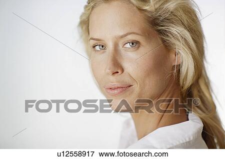 Mid adult woman with blond hair View Large Photo Image Stock Photo - Mid adult woman with blond hair. Fotosearch