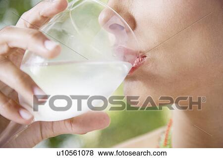 Woman drinking water (close-up) View Large Photo Image Stock Photo - Woman drinking water (close-up). Fotosearch