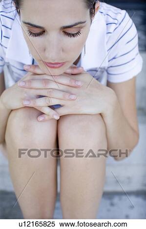 Young adult woman sitting on stairs, High Angle View View Large Photo Image Stock Photography - Young adult woman sitting on stairs, High Angle View. Fotosearch
