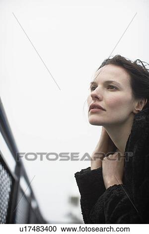 Young woman in fur coat View Large Photo Image Stock Image - Young woman in fur coat. Fotosearch